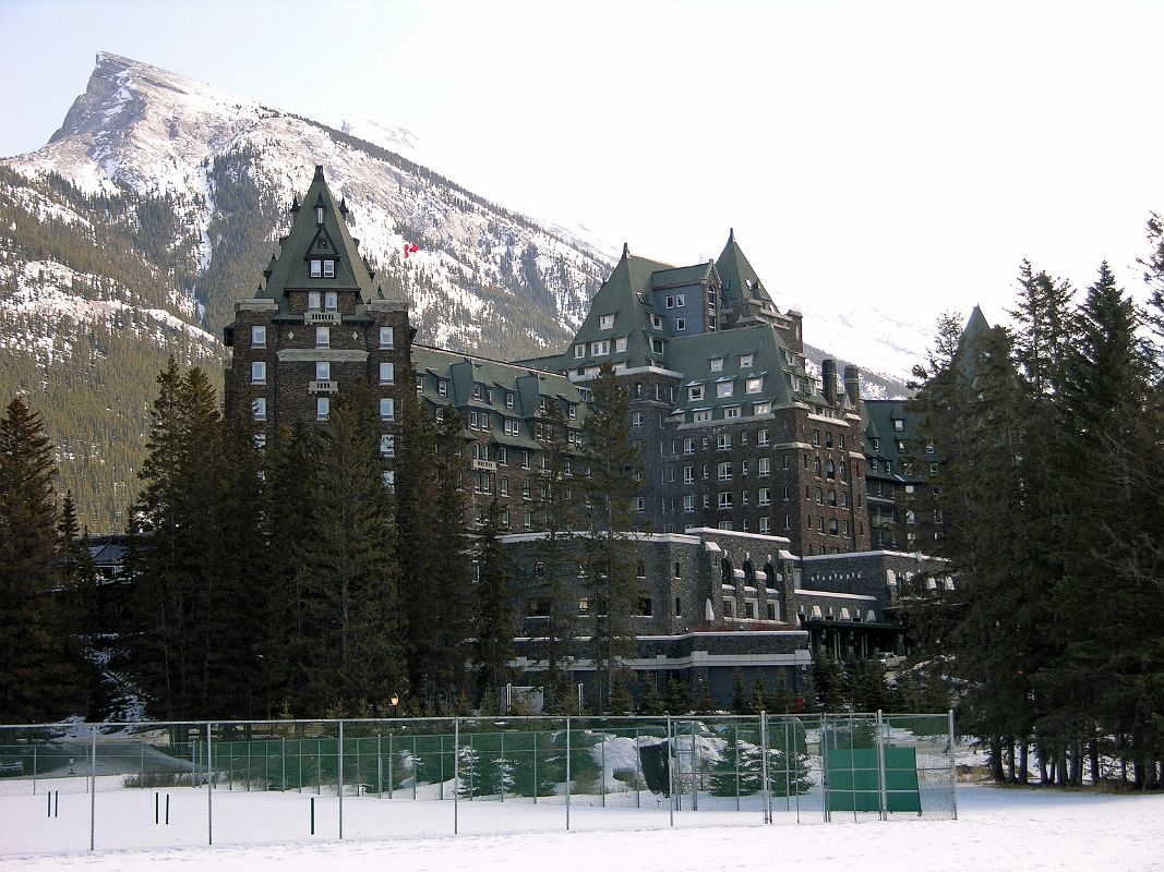 02 Banff Springs Hotel From Tennis Courts And Mount Rundle Behind In Winter